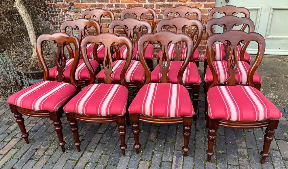 A Set of 12 Victorian Mahogany Spear Point Balloon Back dining Chairs