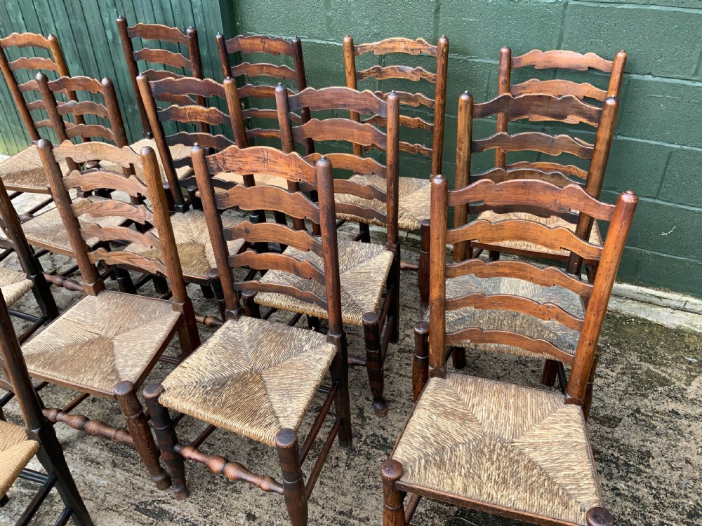 A Harlequin Set of 15 19th century ladder back dining chairs