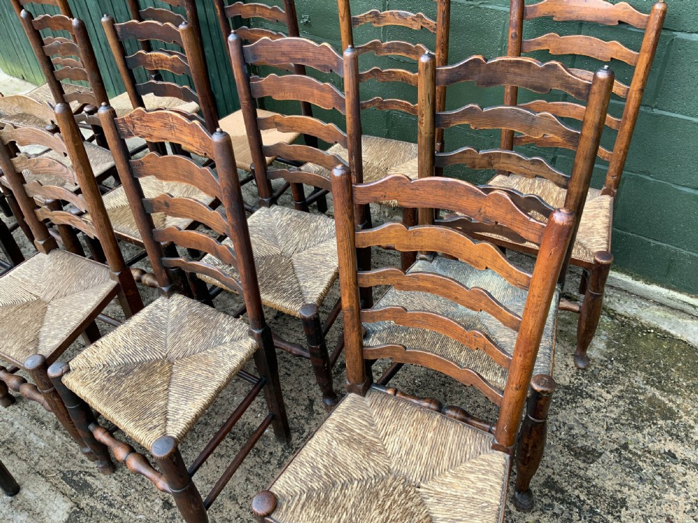 A Harlequin Set of 15 19th century ladder back dining chairs View VI
