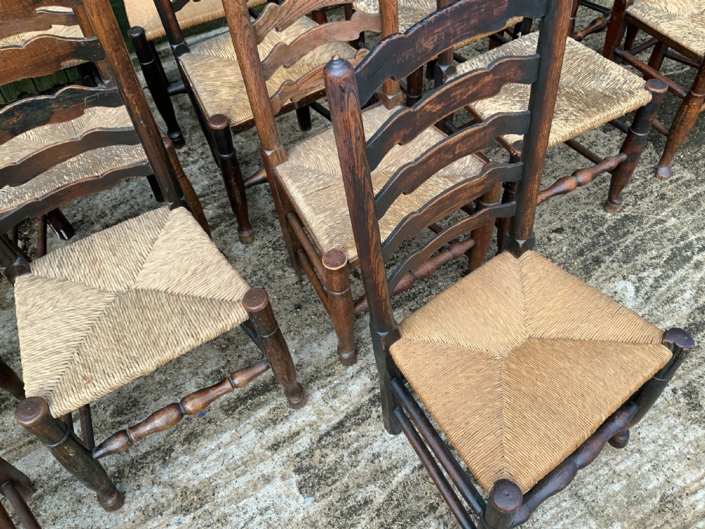 A Harlequin Set of 15 19th century ladder back dining chairs View VII