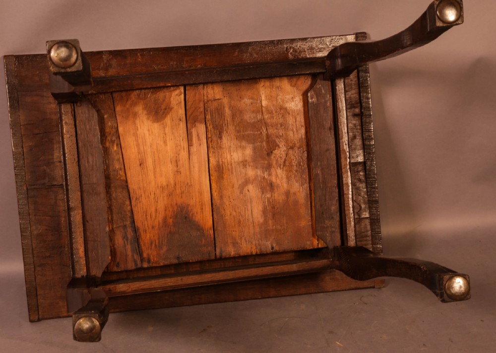 An early 18th-century dark oak side table featuring cabriole legs, a single frieze drawer, and a brass drop handle. View XI