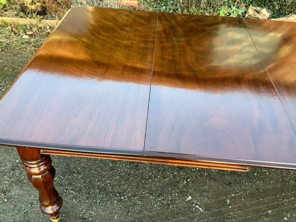 A Victorian Mahogany 3 leaf Extending Dining Table View III