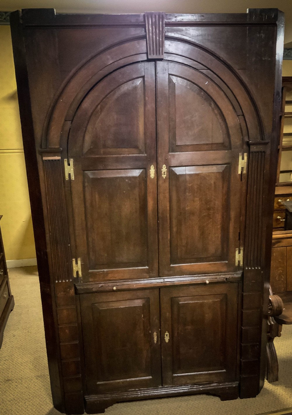 An 18th century full height Corner Cupboard in Oak