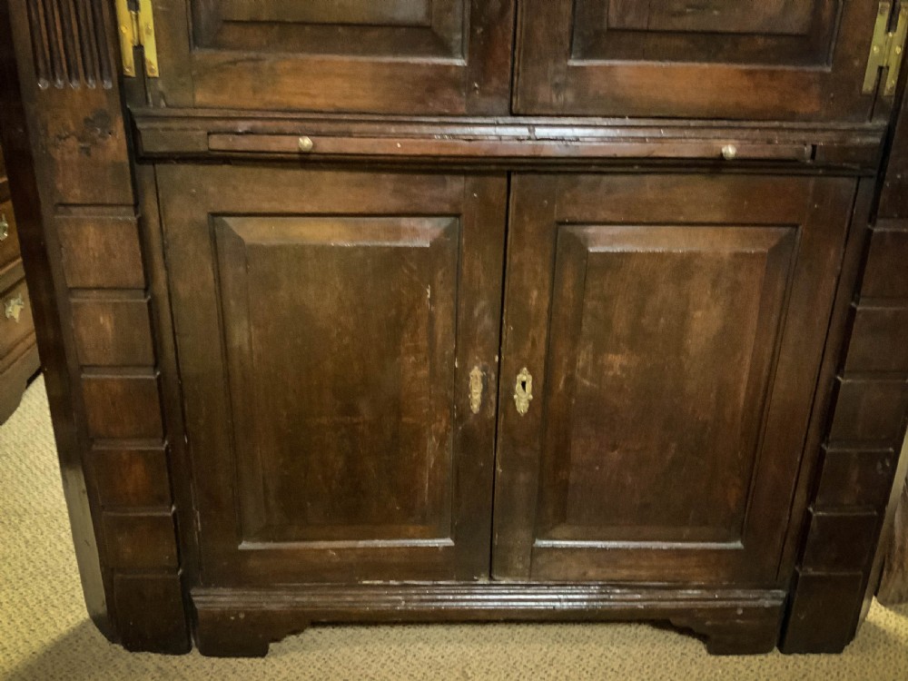 An 18th century full height Corner Cupboard in Oak View V