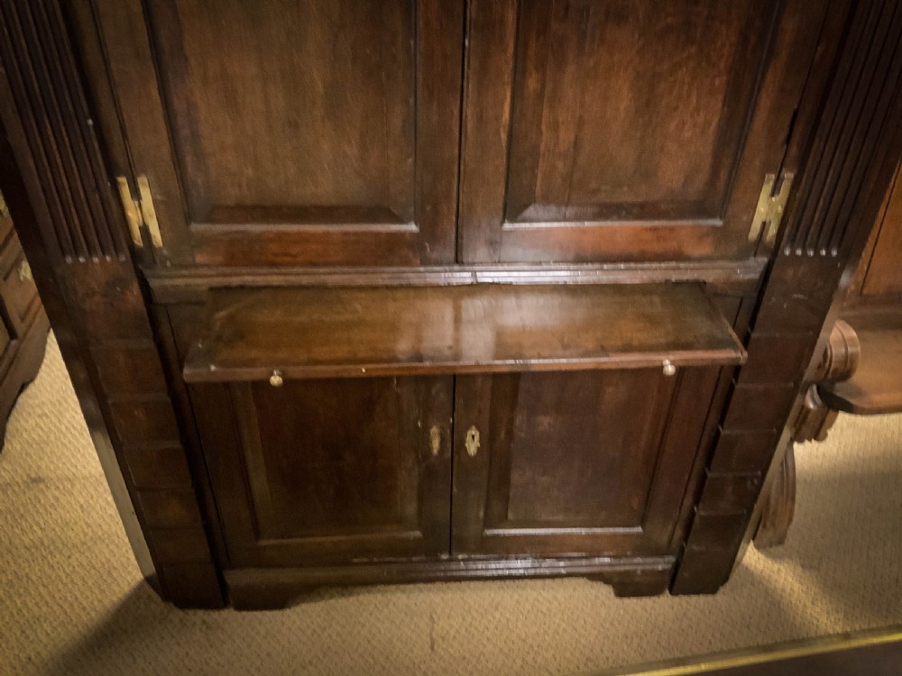 An 18th century full height Corner Cupboard in Oak View VI