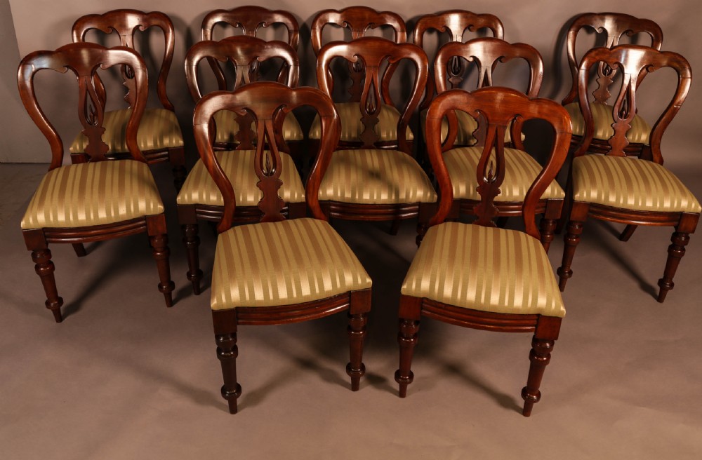 A Set of 12 Victorian Spear Point Balloon back Dining Chairs View II