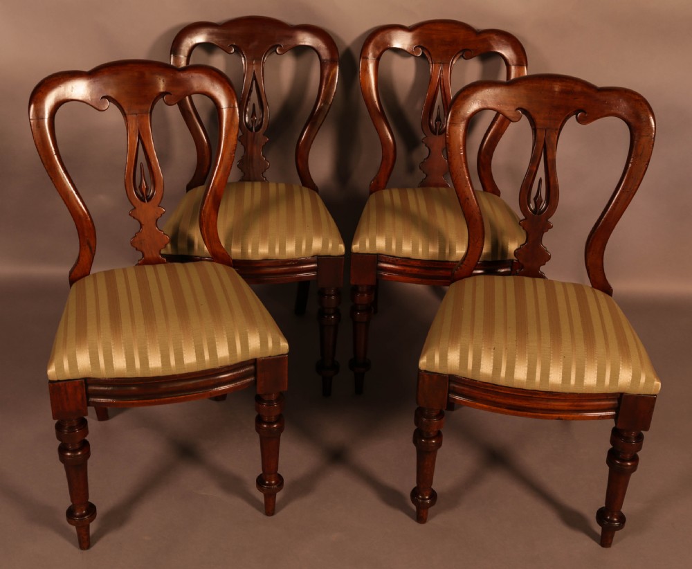 A Set of 12 Victorian Spear Point Balloon back Dining Chairs View VI
