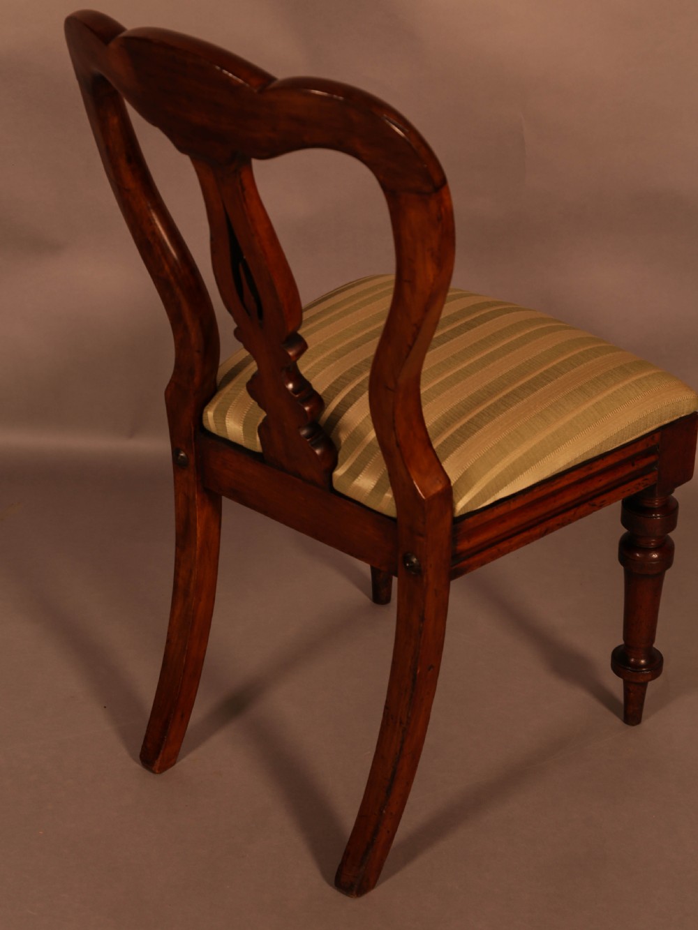 A Set of 12 Victorian Spear Point Balloon back Dining Chairs View X