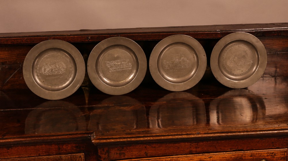 A Set of 4 pewter plates with engraved decoration