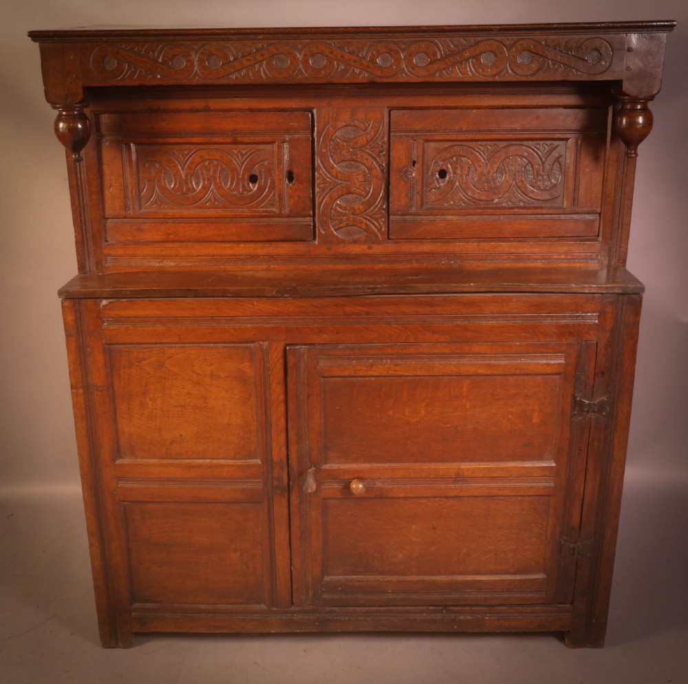 A Small 17th century Cupboard in Oak original carving