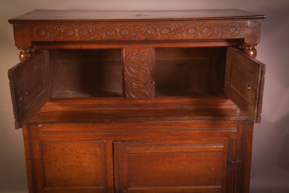 A Small 17th century Cupboard in Oak original carving View III