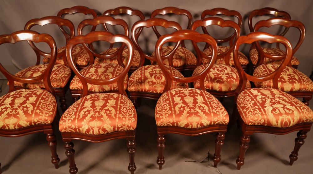 A Rare set of 16 Victorian Mahogany Balloon Back Dining Chairs