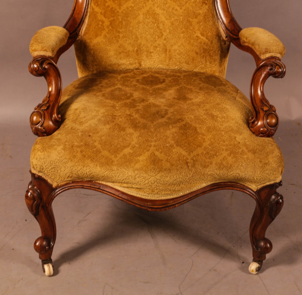 A Victorian Walnut spoon back armchair View III