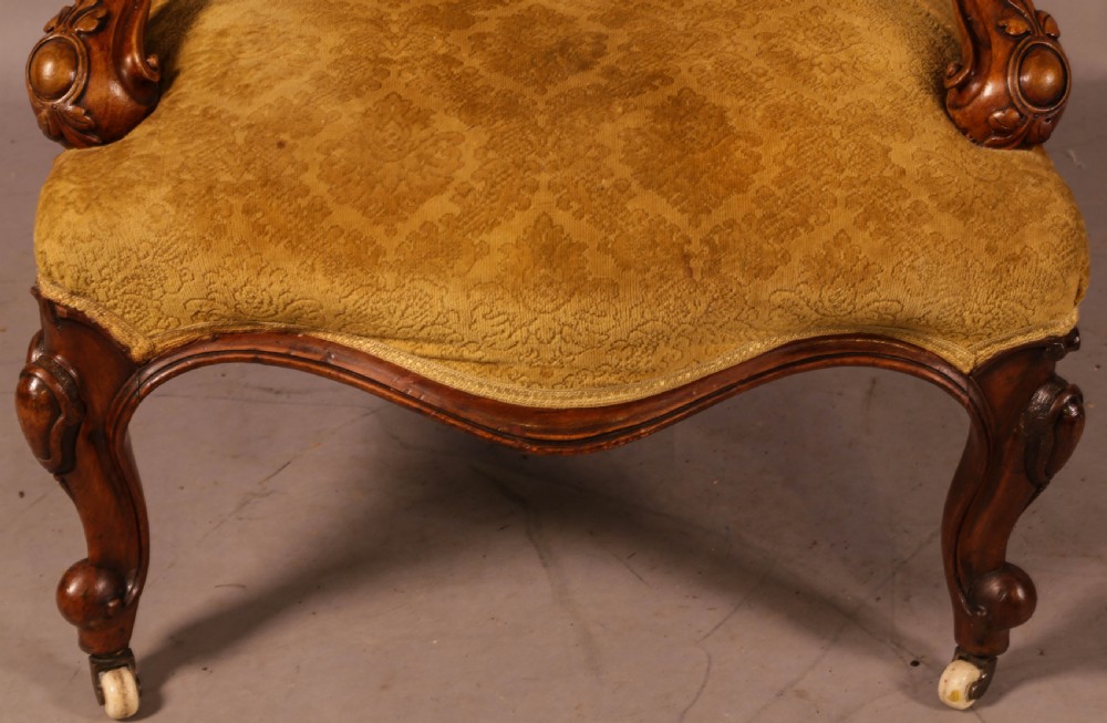 A Victorian Walnut spoon back armchair View V