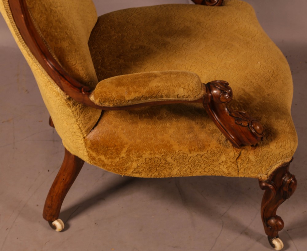 A Victorian Walnut spoon back armchair View VII