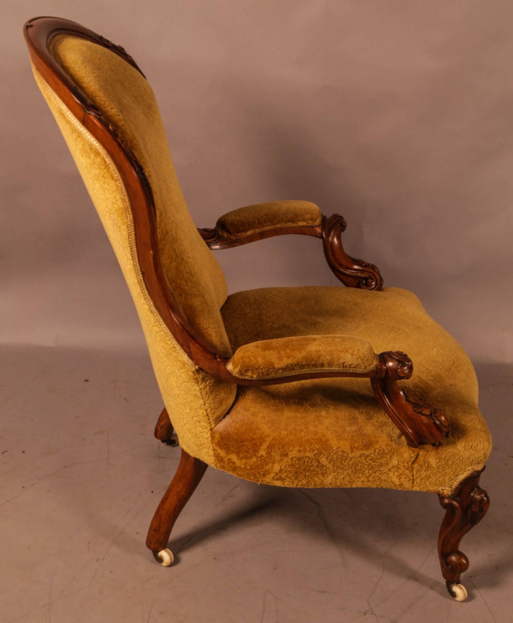 A Victorian Walnut spoon back armchair View VIII