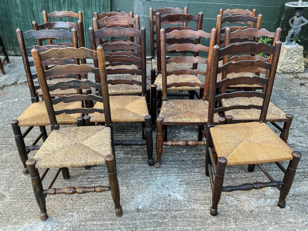 a harlequin set of 12 early 19th century ladder back chairs View II