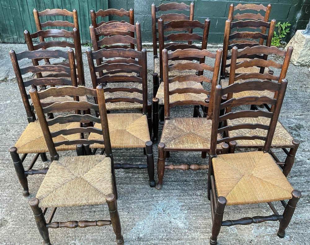 a harlequin set of 12 early 19th century ladder back chairs View III