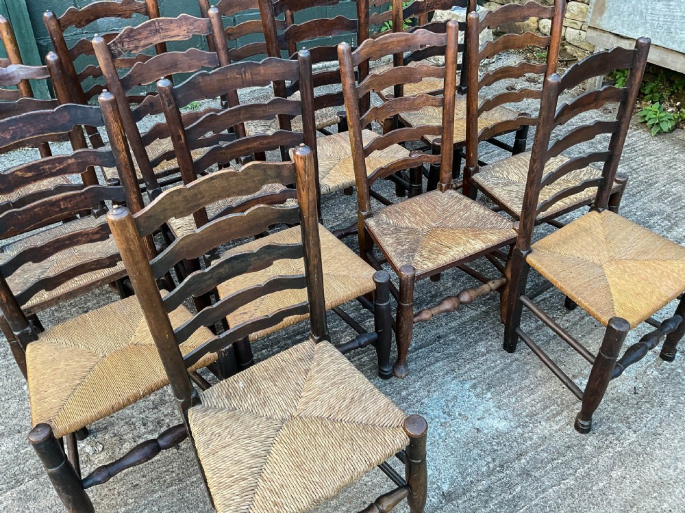 a harlequin set of 12 early 19th century ladder back chairs View IV