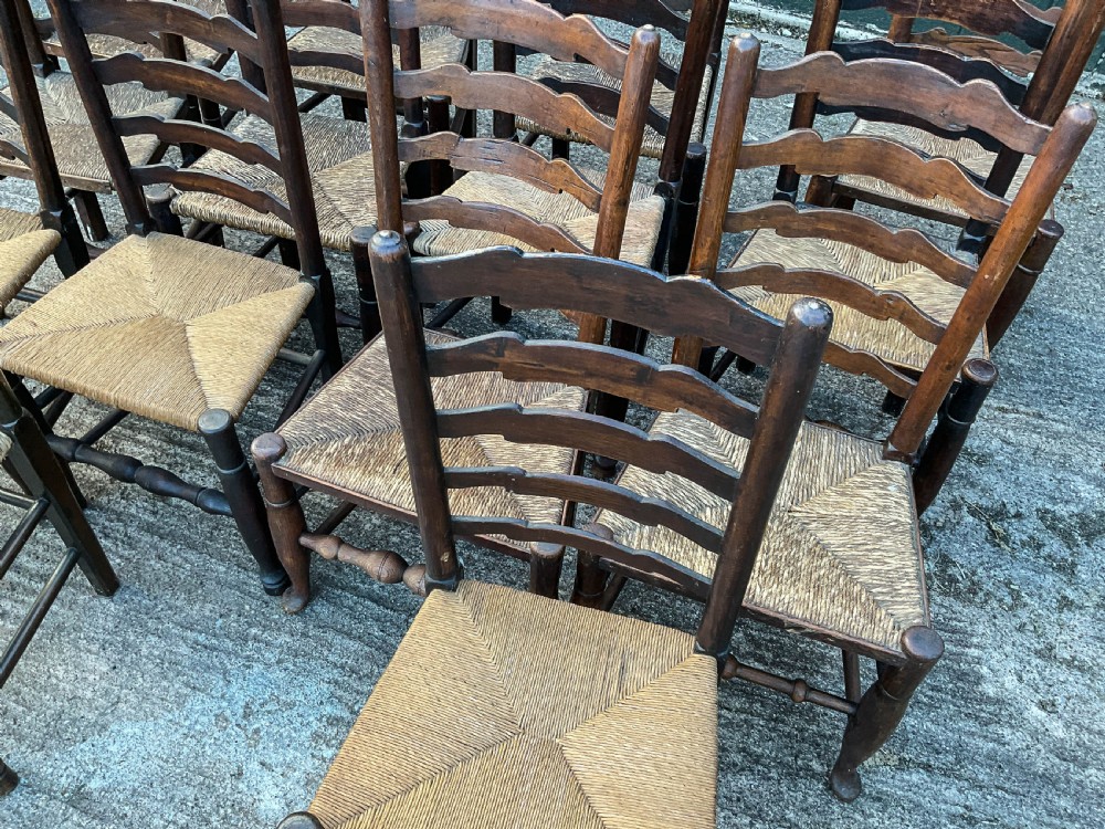 a harlequin set of 12 early 19th century ladder back chairs View VI