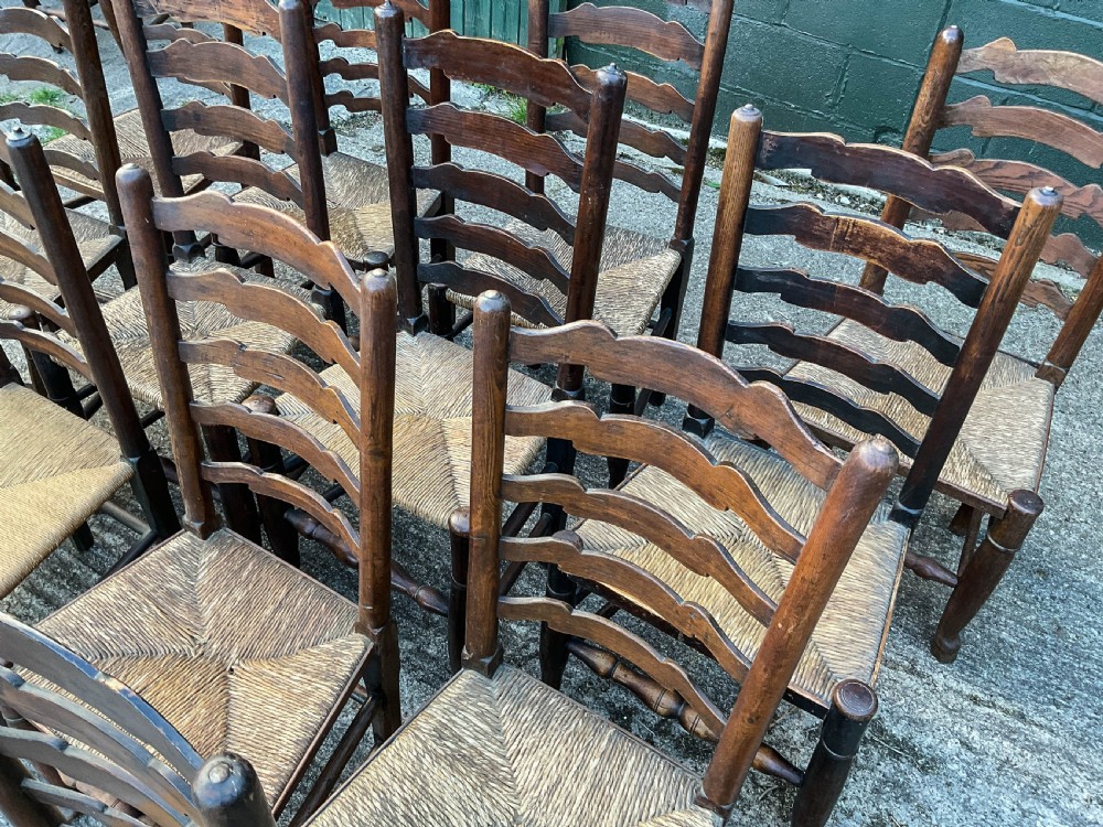 a harlequin set of 12 early 19th century ladder back chairs View VII