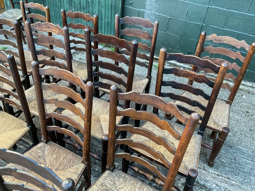 a harlequin set of 12 early 19th century ladder back chairs View VIII