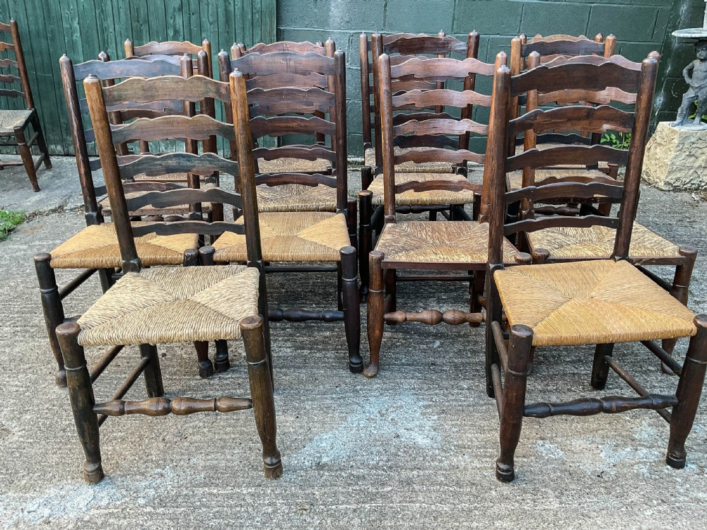 a harlequin set of 12 early 19th century ladder back chairs View IX
