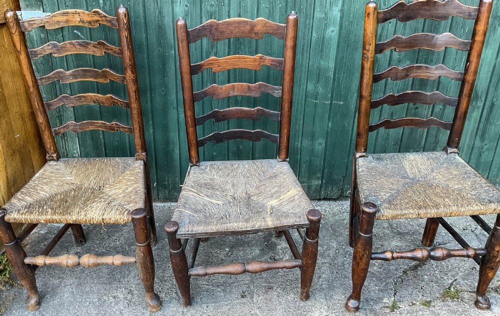 a harlequin set of 12 early 19th century ladder back chairs View X
