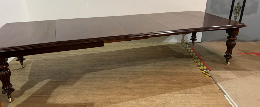 A Large Victorian Mahogany Dining Table seats 12/14 View VI