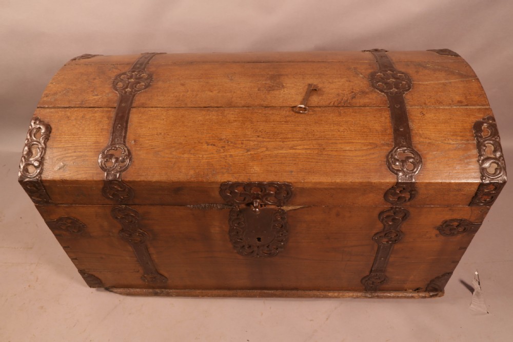 An 18th-century oak trunk with a domed lid and decorative iron strapwork. View III