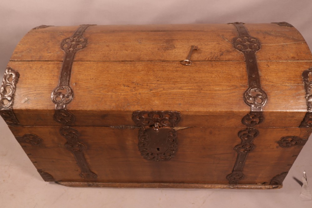 An 18th-century oak trunk with a domed lid and decorative iron strapwork. View IV