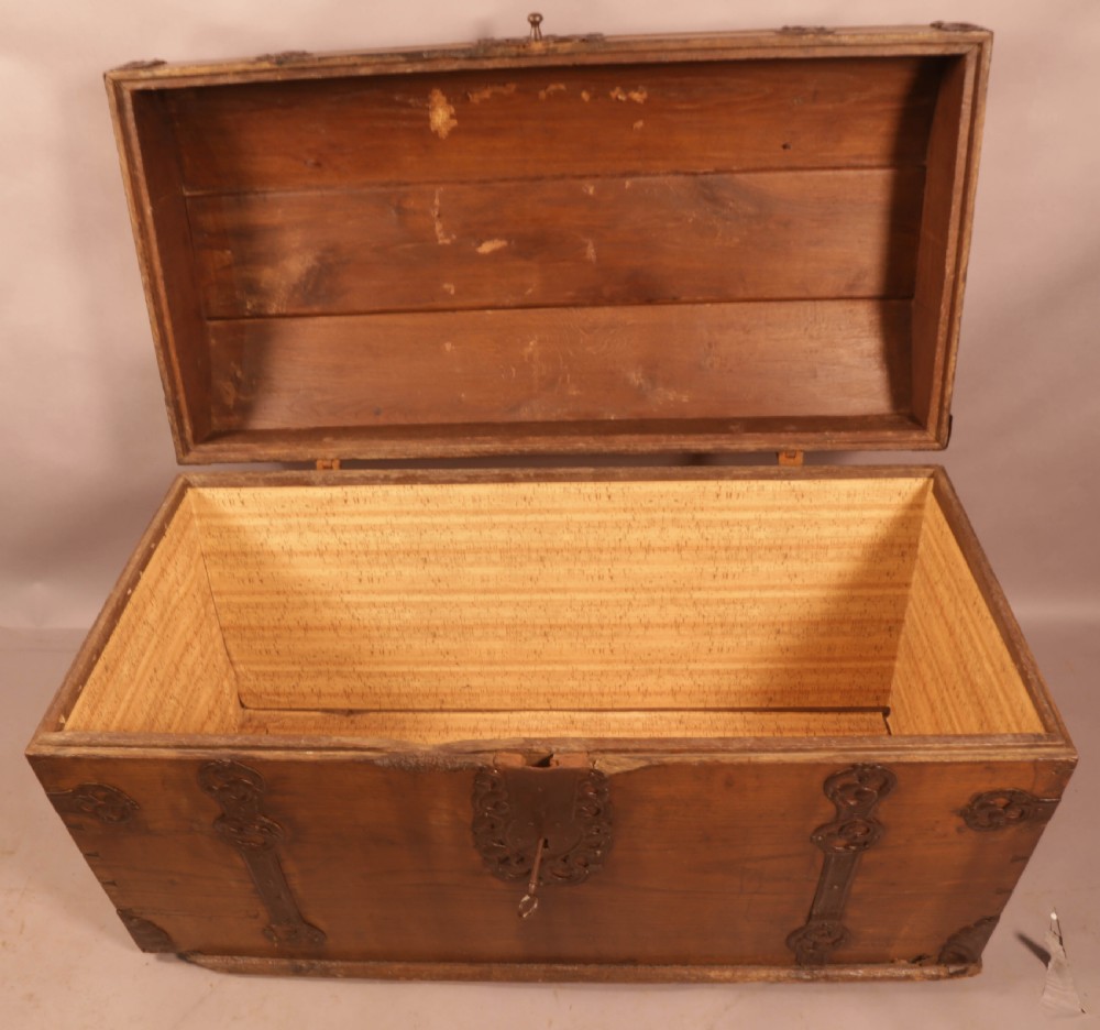 An 18th-century oak trunk with a domed lid and decorative iron strapwork. View VI