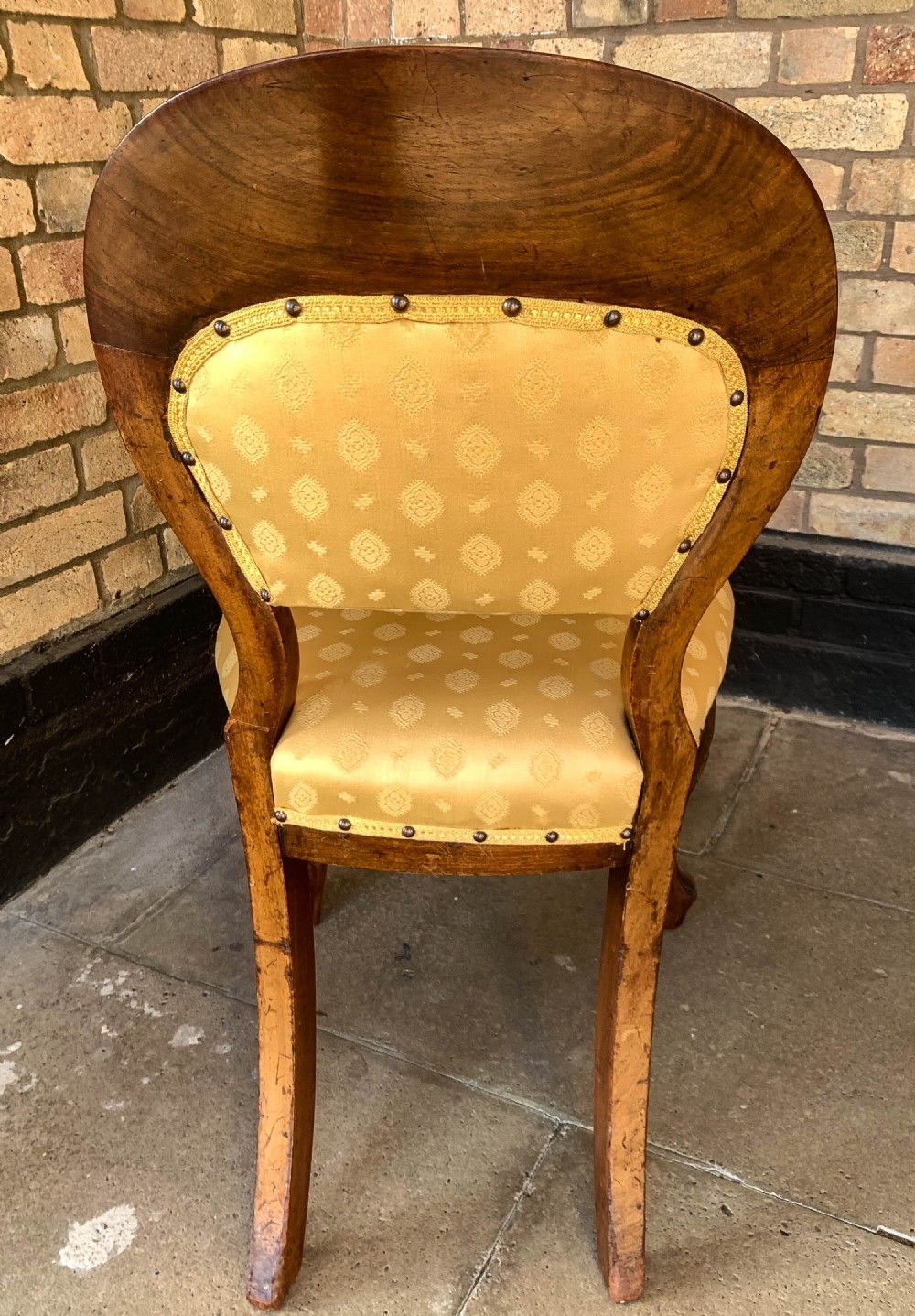 A set of eight Victorian mahogany dining chairs featuring gold patterned fabric upholstery, balloon backs, and cabriole legs. View XI