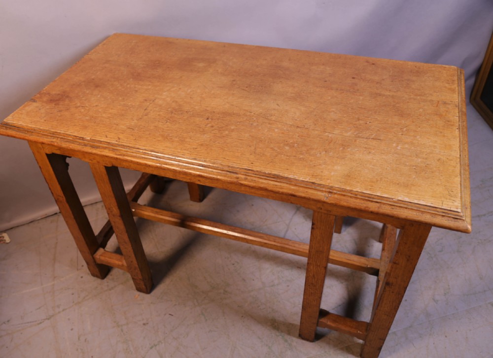 A 19th-century oak Gothic Revival serving table featuring carved pointed arch spandrels and a low box stretcher. View II