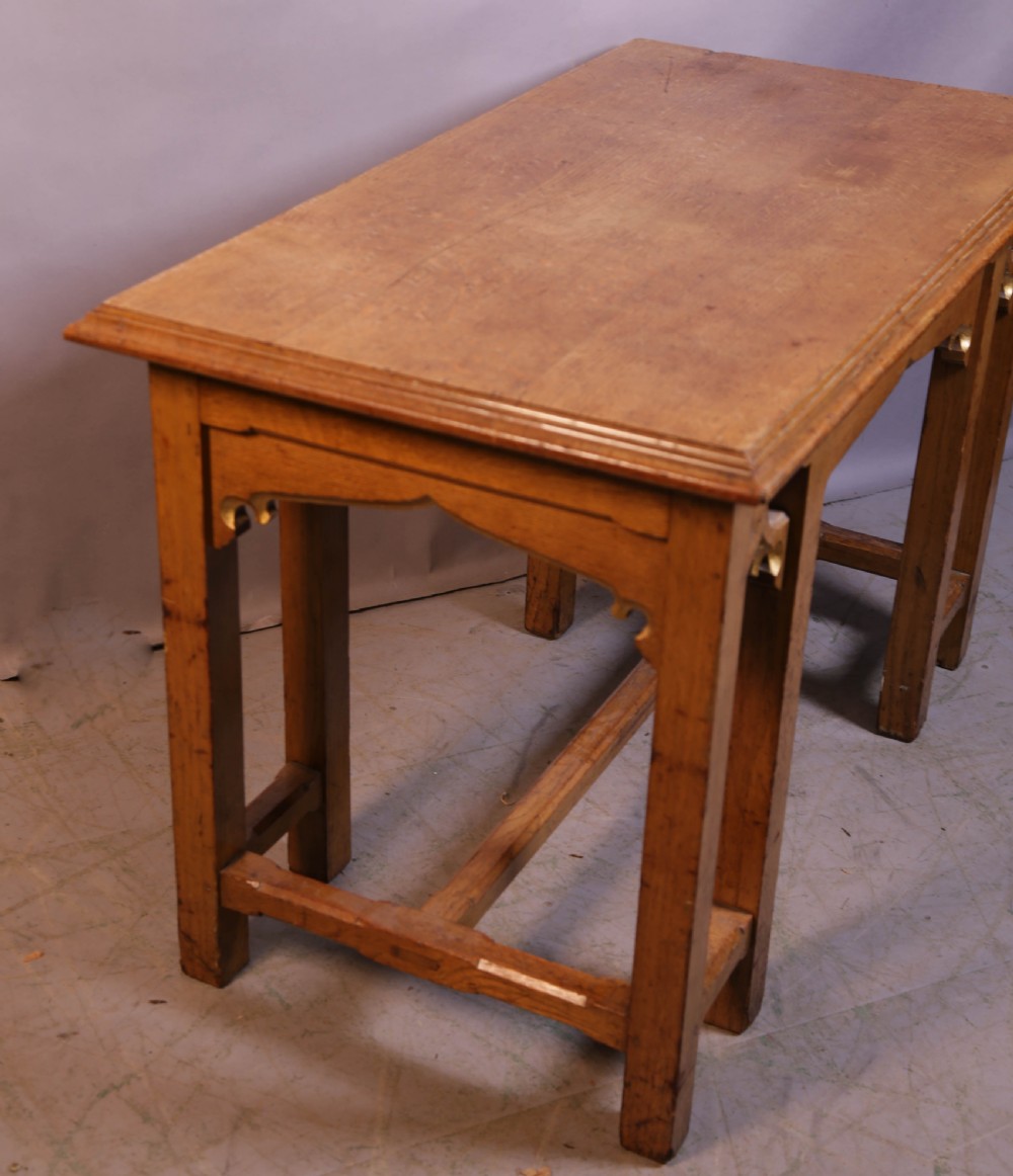 A 19th-century oak Gothic Revival serving table featuring carved pointed arch spandrels and a low box stretcher. View VII