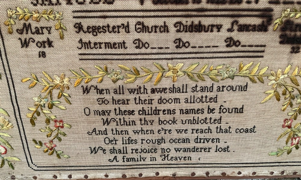 An 1832 Georgian embroidered linen needlework sampler featuring a family register, verse, winged figures, and a floral border. View II