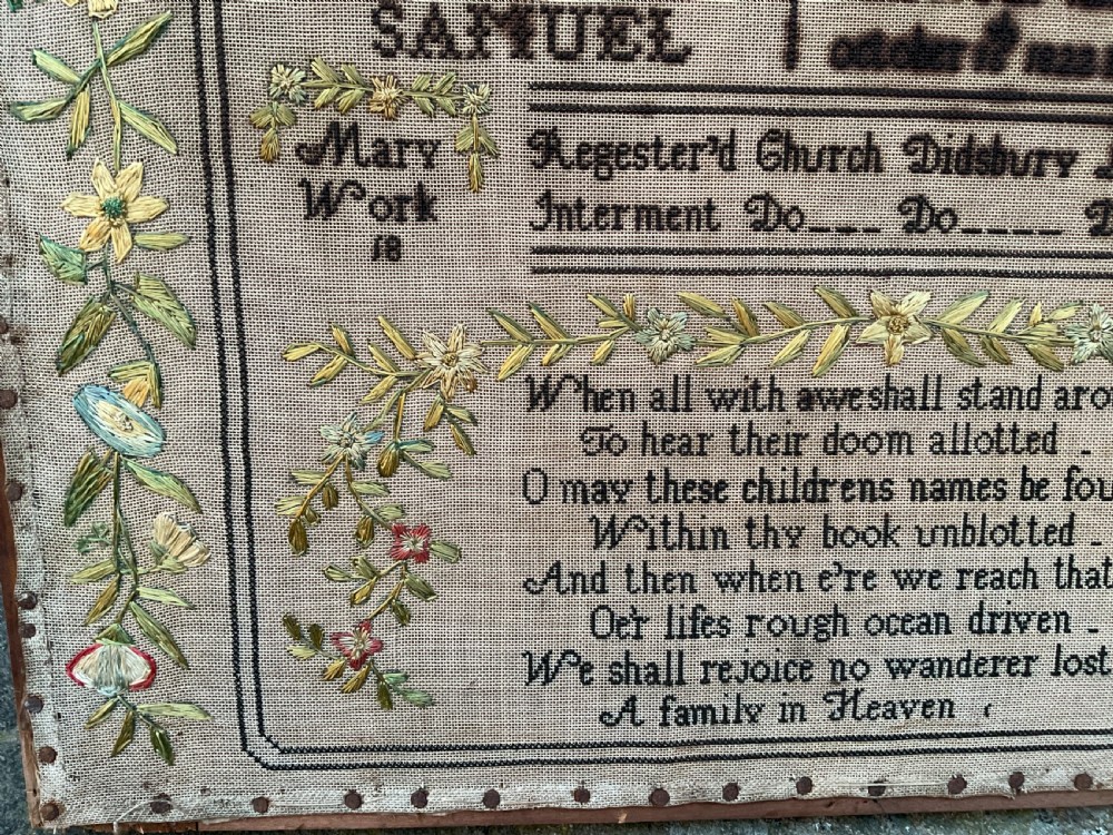 An 1832 Georgian embroidered linen needlework sampler featuring a family register, verse, winged figures, and a floral border. View IX