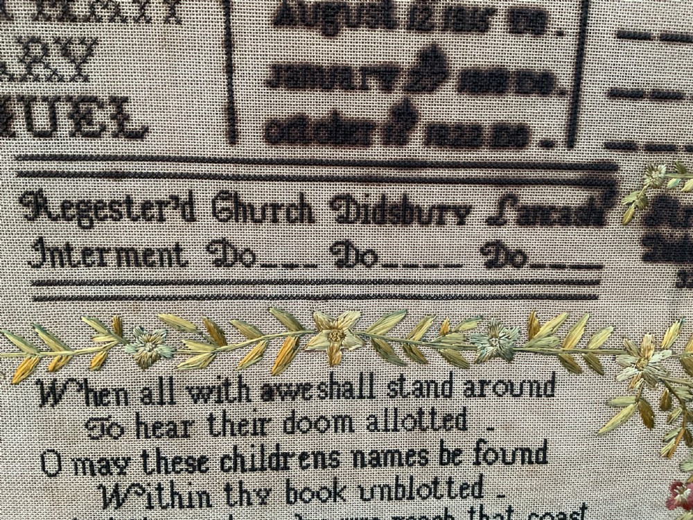 An 1832 Georgian embroidered linen needlework sampler featuring a family register, verse, winged figures, and a floral border. View XI