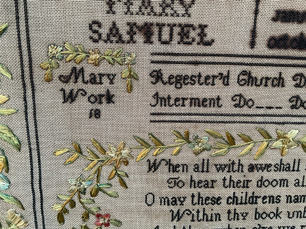 An 1832 Georgian embroidered linen needlework sampler featuring a family register, verse, winged figures, and a floral border. View XII