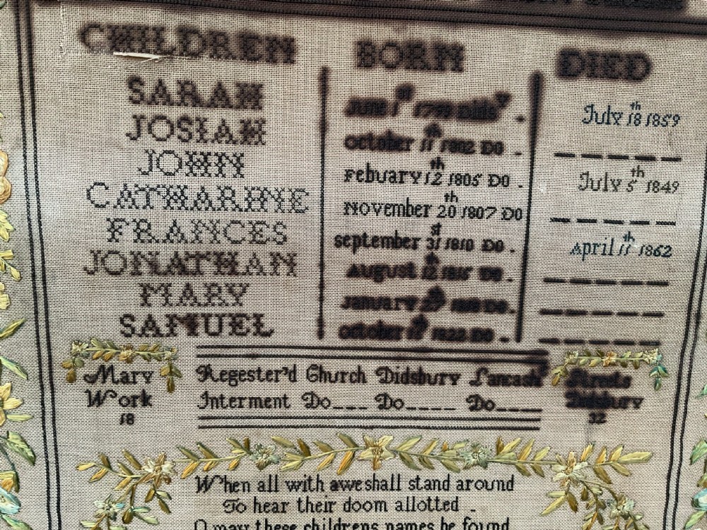 An 1832 Georgian embroidered linen needlework sampler featuring a family register, verse, winged figures, and a floral border. View XIII