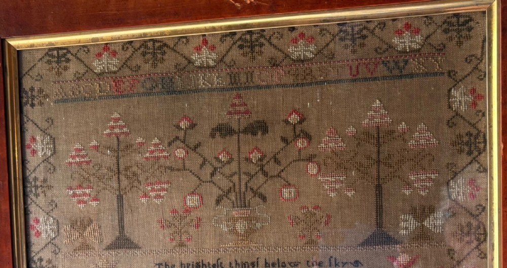 Framed Victorian needlework sampler featuring embroidered alphabets, floral motifs, a central verse, and a signature line dated 1847 set within a wide wooden frame. View V