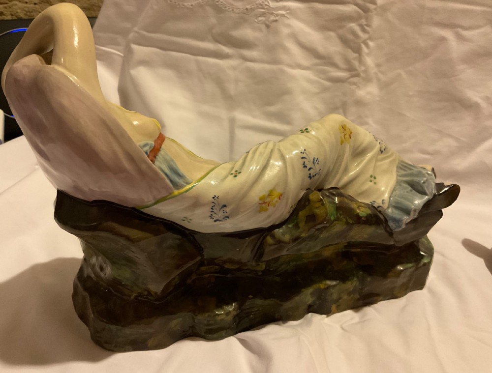 A pair of antique ceramic reclining figures depicting Mark Antony and Cleopatra on moulded bases. View XI
