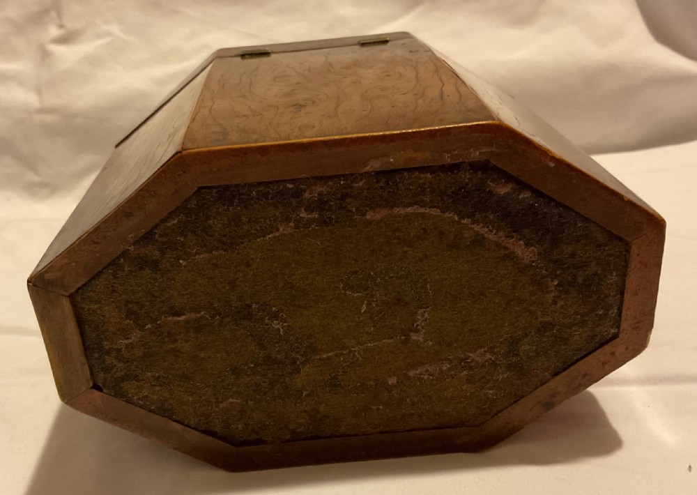 An octagonal Georgian yew wood tea caddy featuring an acorn inlay on the front panel and a bone keyhole escutcheon. View VIII