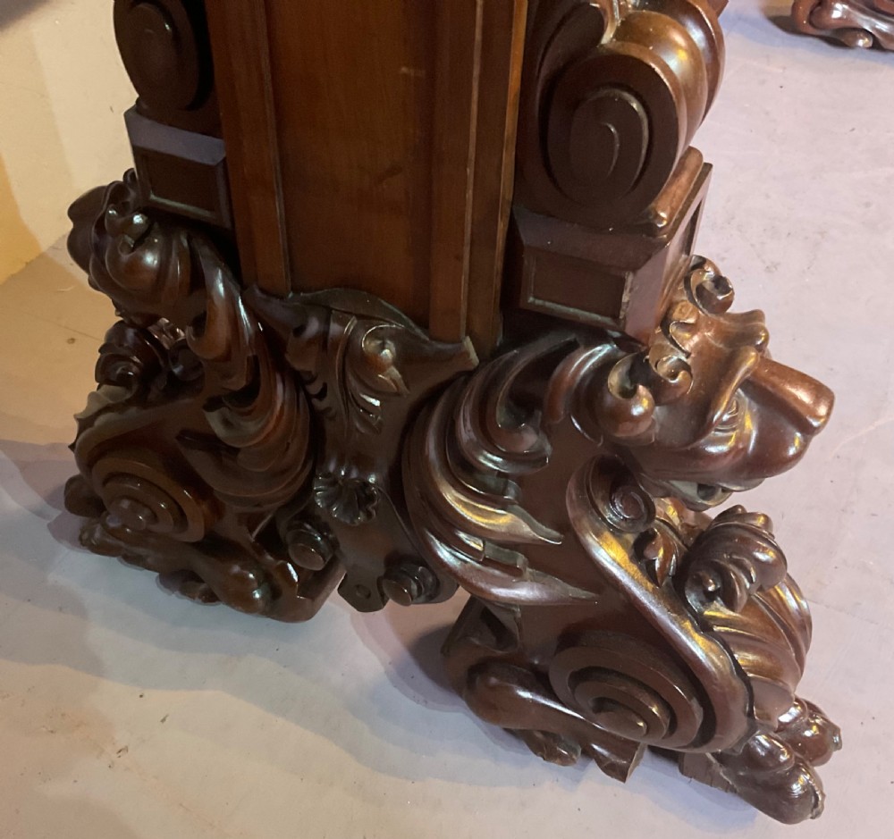 A Victorian three-tiered mahogany metamorphic dumb waiter featuring rounded shelf edges and carved scroll feet. View VIII