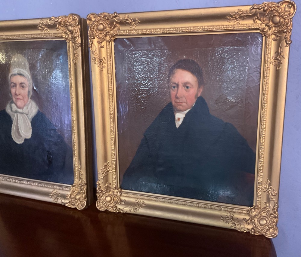 A pair of Regency period oil paintings on canvas depicting a gentleman and a lady in matching ornate gold gilt frames. View V