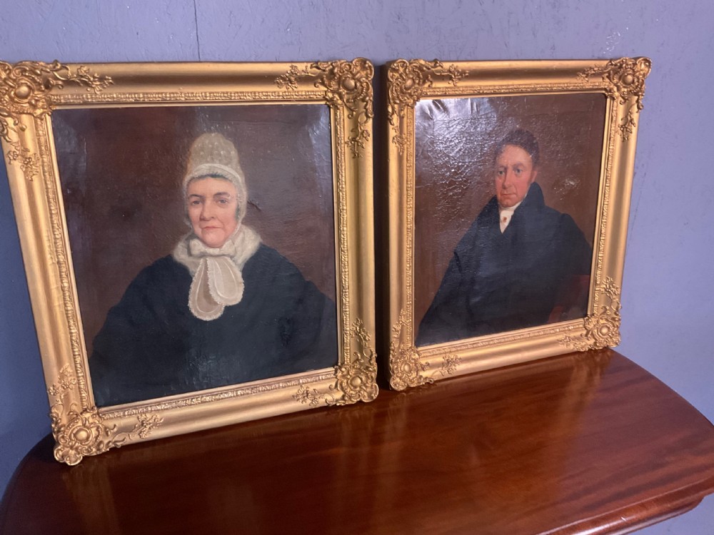 A pair of Regency period oil paintings on canvas depicting a gentleman and a lady in matching ornate gold gilt frames. View VIII