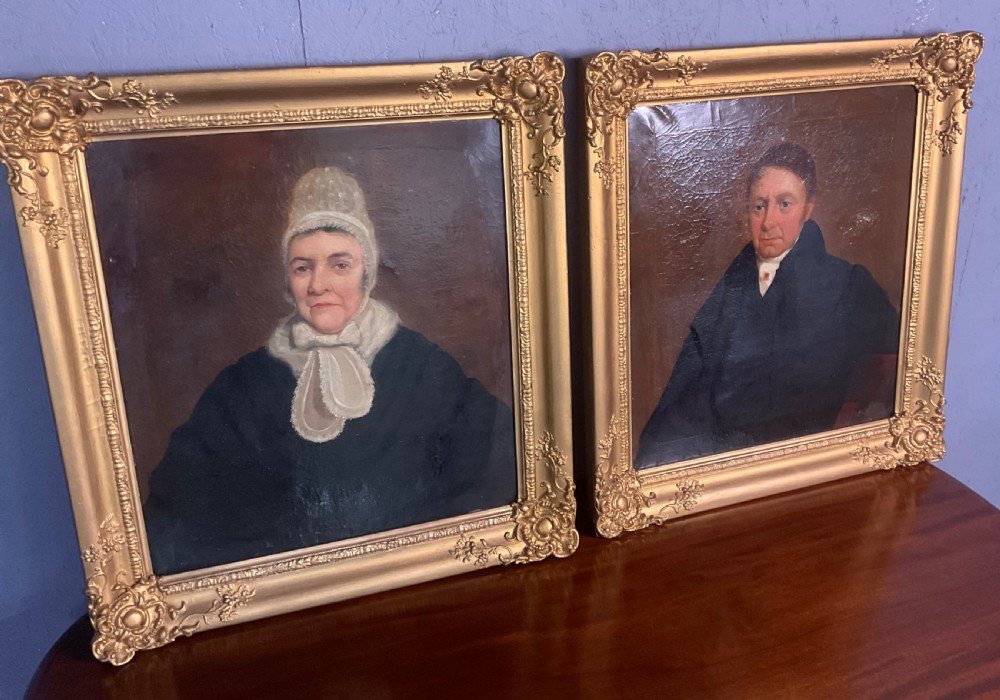 A pair of Regency period oil paintings on canvas depicting a gentleman and a lady in matching ornate gold gilt frames. View IX