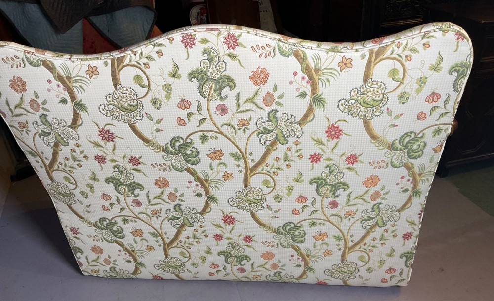 A Queen Anne style walnut settee featuring contoured wooden arms, a shaped upholstered backrest, and botanical floral pattern fabric. View XIII