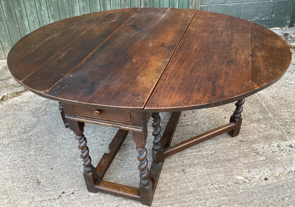A super large 17th c gate table in Oak seat 8