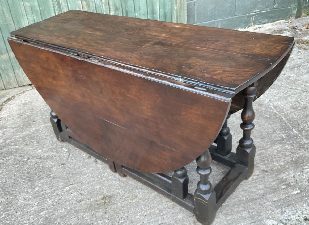 A super large 17th c gate table in Oak seat 8 View XXI